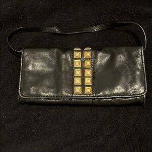 Chic Black Michael Kor’s Leather Clutch with Gold Accents